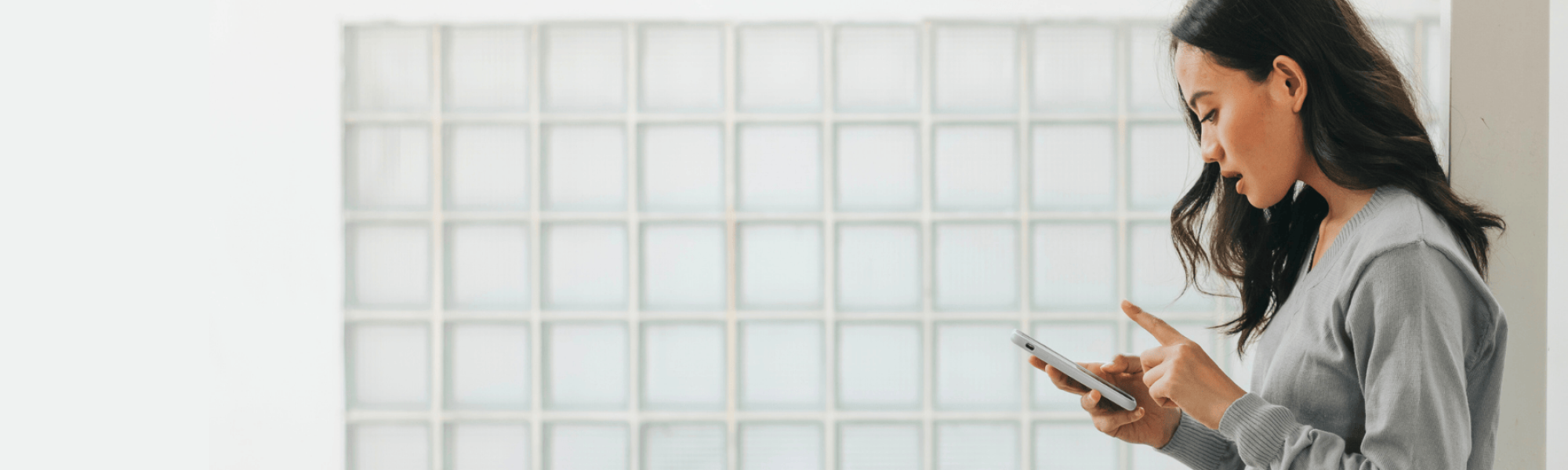 Woman looking down at her phone