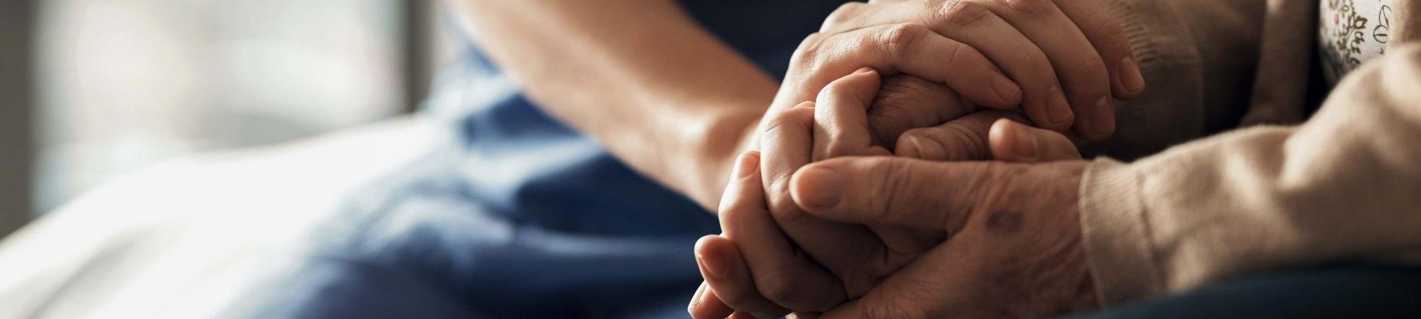 Two people holding hands