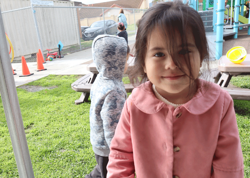 Young girl with hair in her face