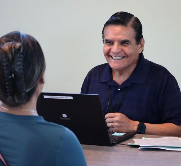 VITA volunteer talking to client